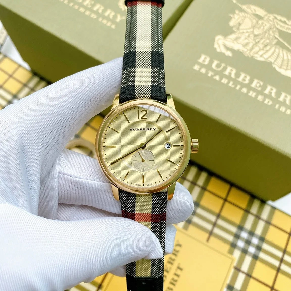Burberry BU10001 gold dial watch with leather and fabric strap
