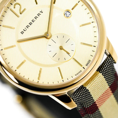 Burberry BU10001 leather and fabric strap watch close-up with gold dial