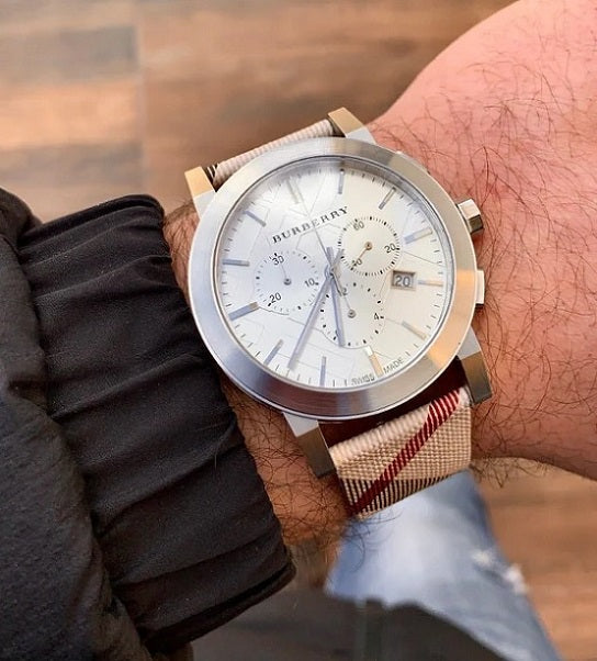 Burberry BU9357 men’s watch on wrist with silver dial and multicolour strap