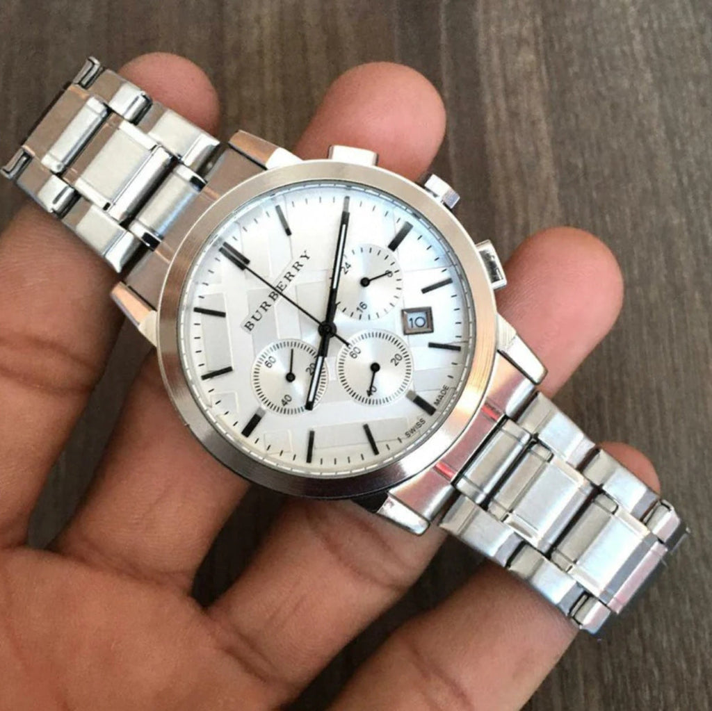 Burberry BU9750 watch held in gloves