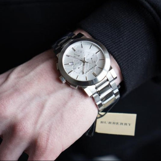 Burberry men’s silver chronograph watch worn on wrist