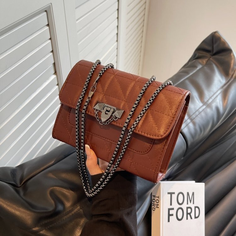 Kenike chain lock shoulder bag interior compartment detail
