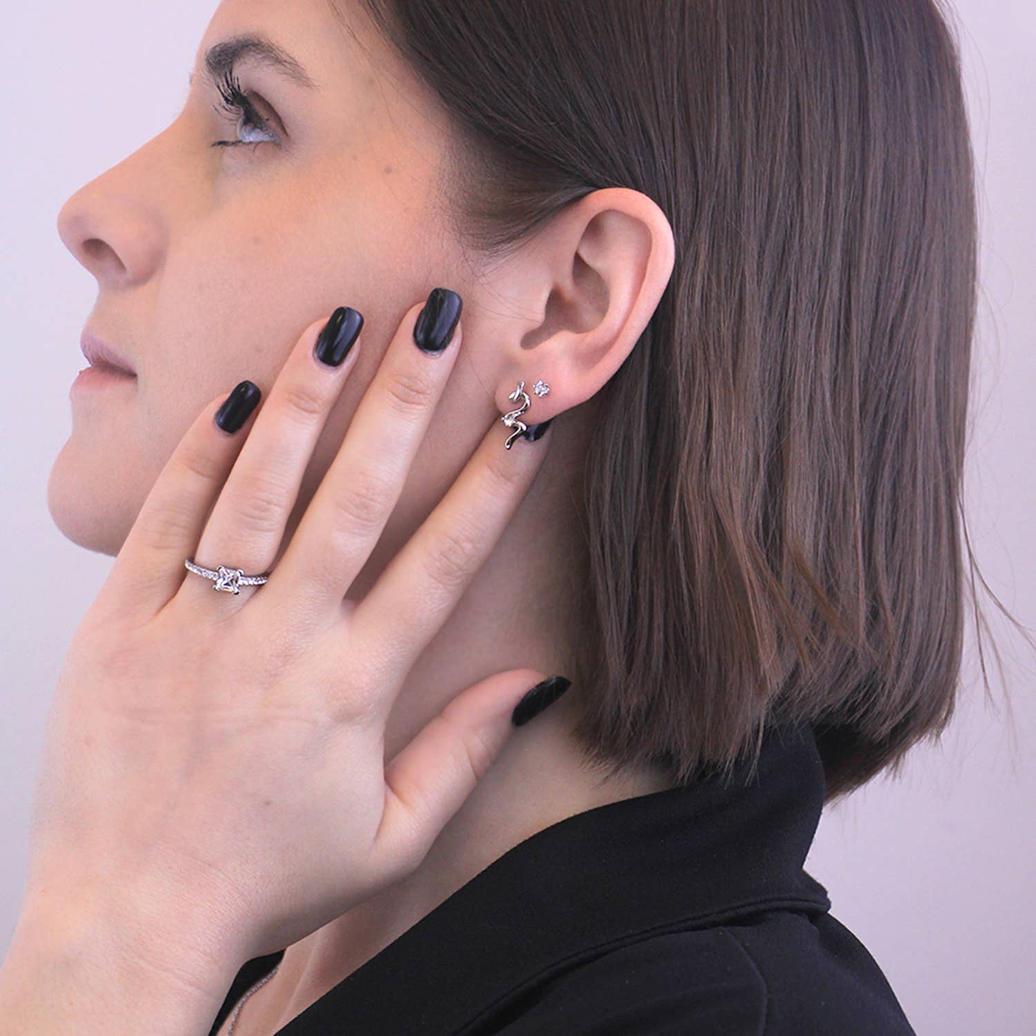 Silver crystal spiral earrings angled view