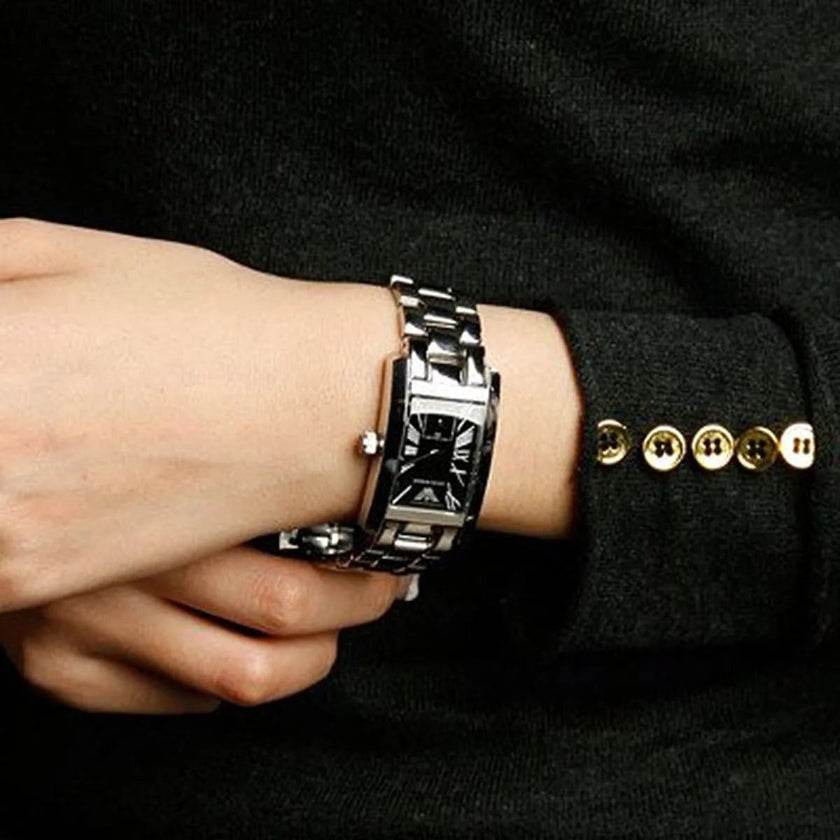 Emporio Armani AR0157 women’s silver bracelet watch on wrist with black dial