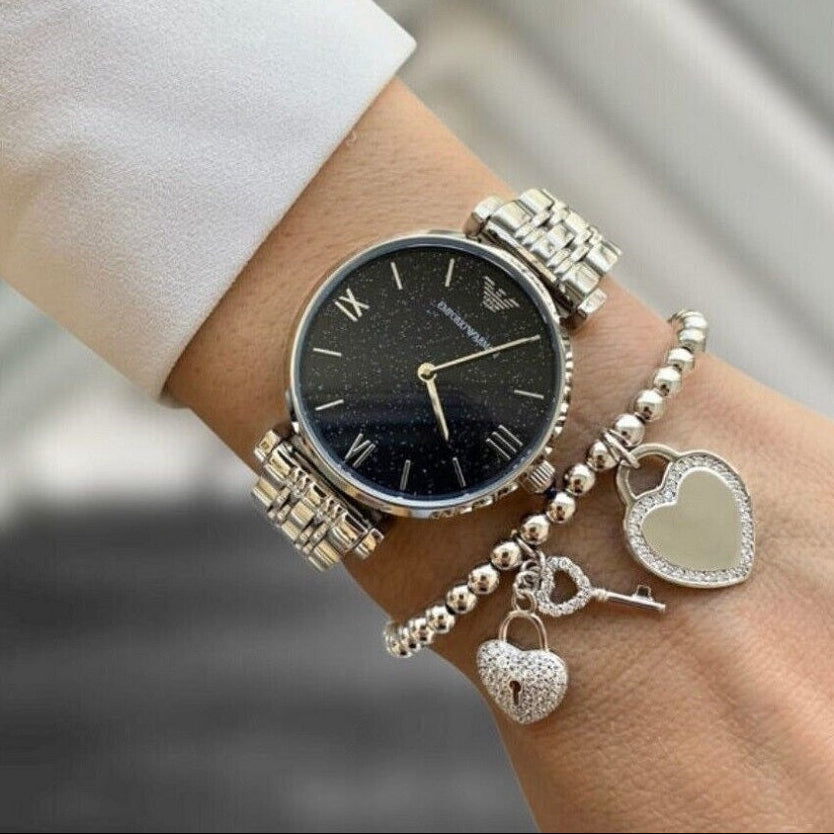 Emporio Armani AR11091 watch on wrist with silver strap and blue dial