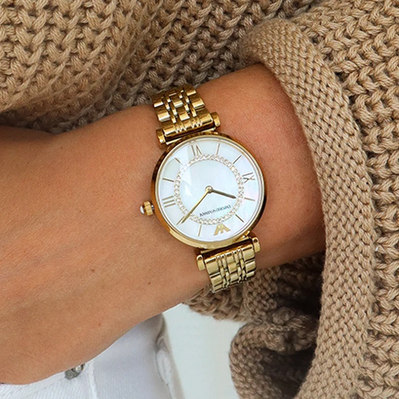 Emporio Armani AR1907 gold watch close-up on wrist