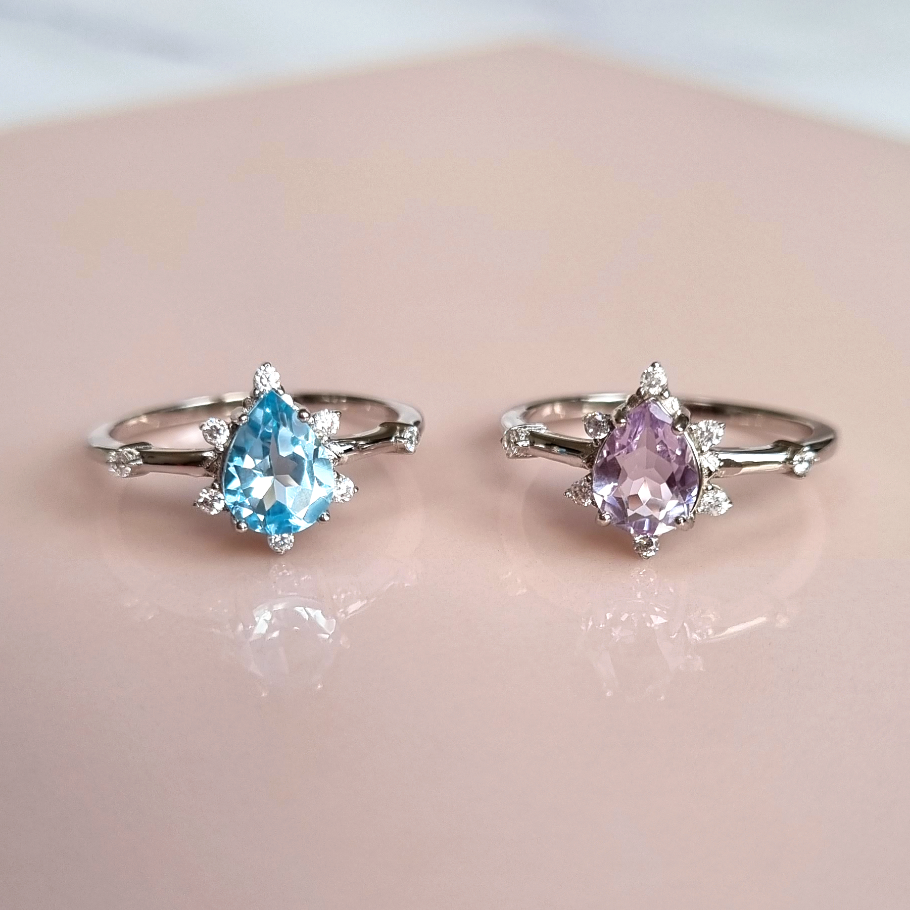 Estelle sky blue topaz and lavender amethyst rings group image