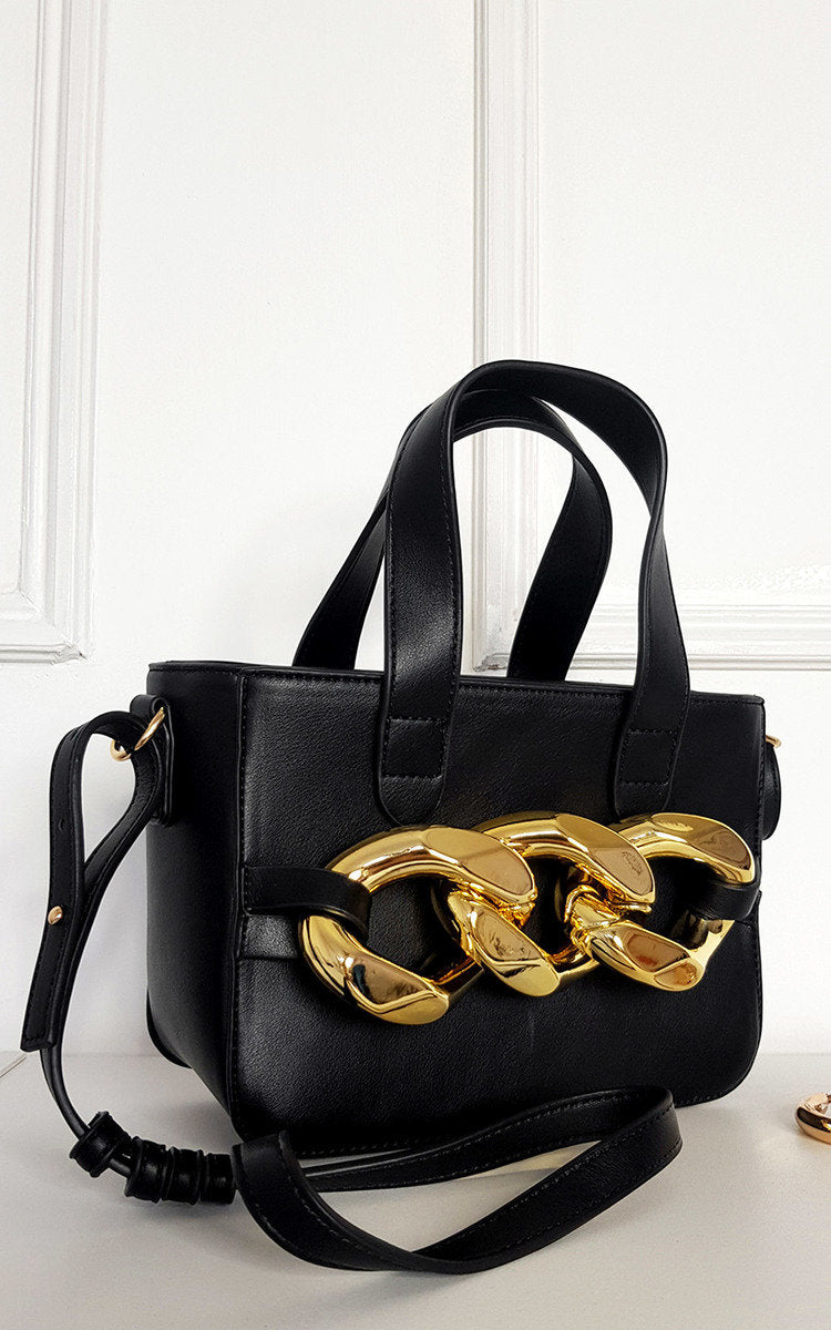 Kenike black faux leather bag with extreme chain detail close-up