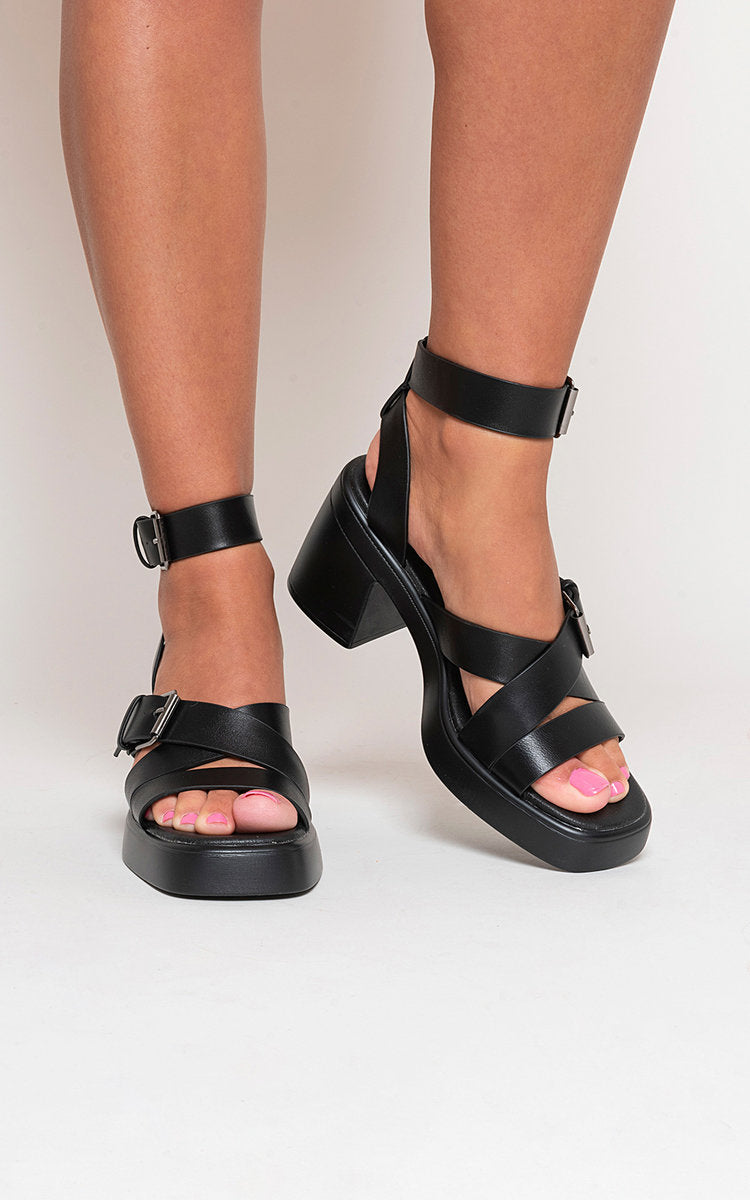 Kenike black criss-cross ankle strap heeled sandals front view