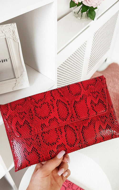 Kenike snake print envelope clutch bag in red front view
