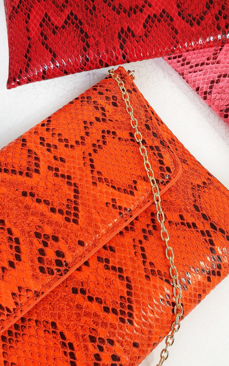 Kenike coral snake print envelope clutch bag front view