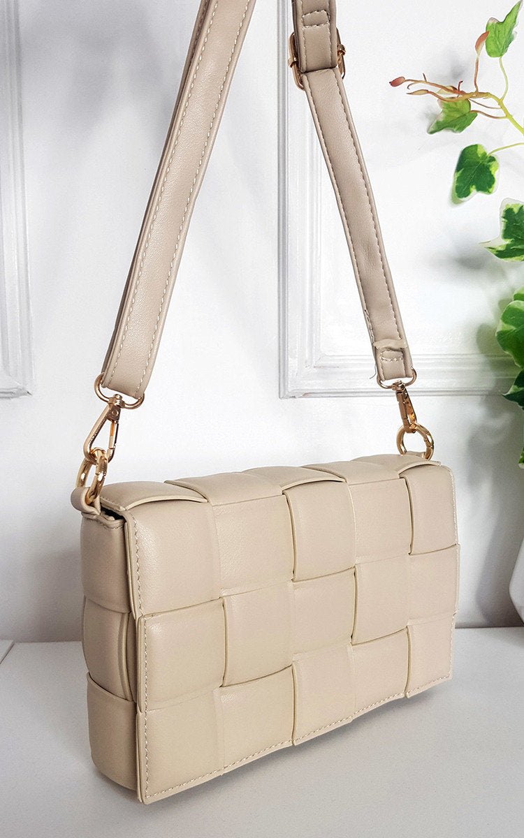 Kenike beige padded shoulder bag with chain detail front view