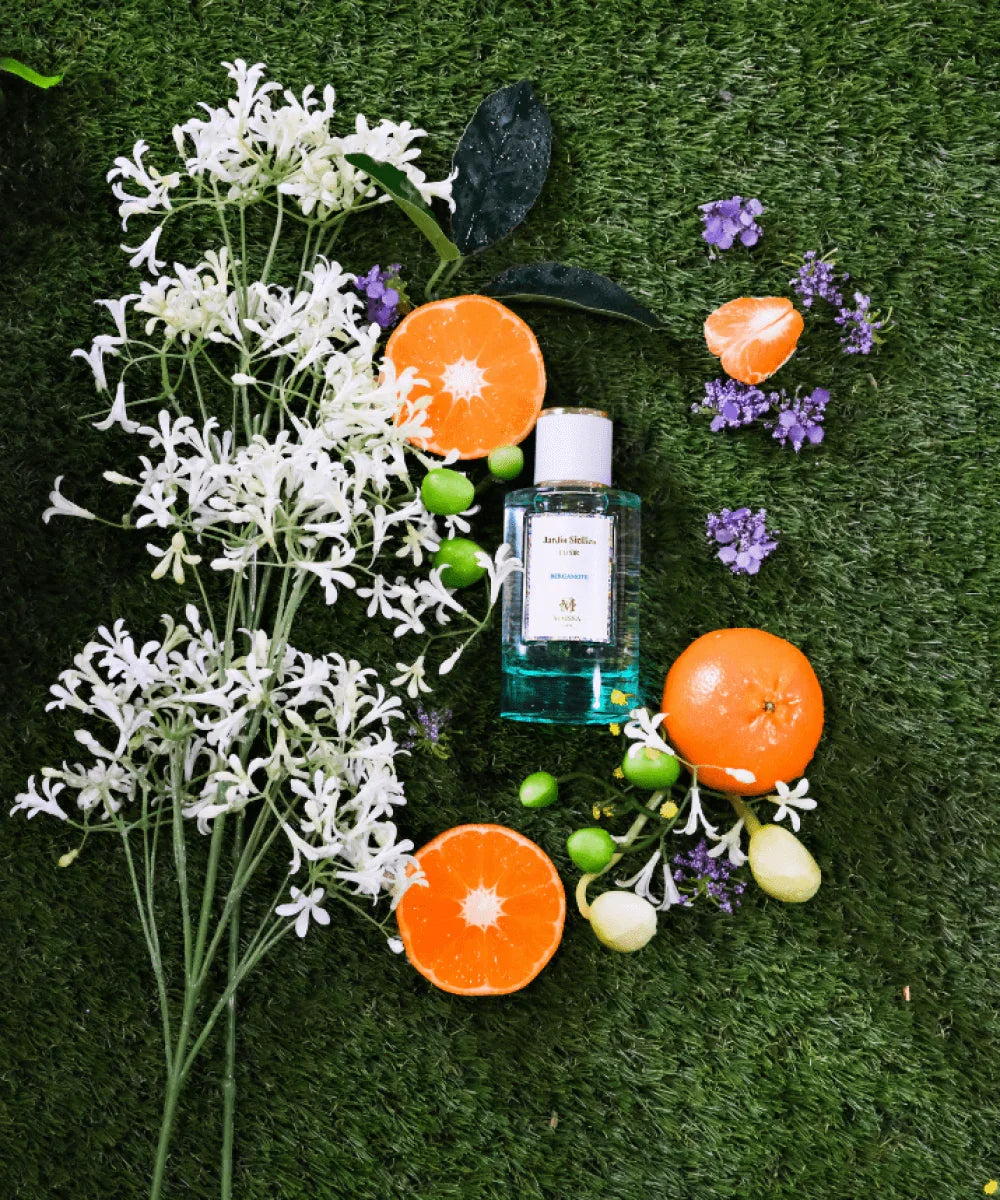 Maïssa Jardin Sicilien perfume bottle with Mediterranean citrus floral scene