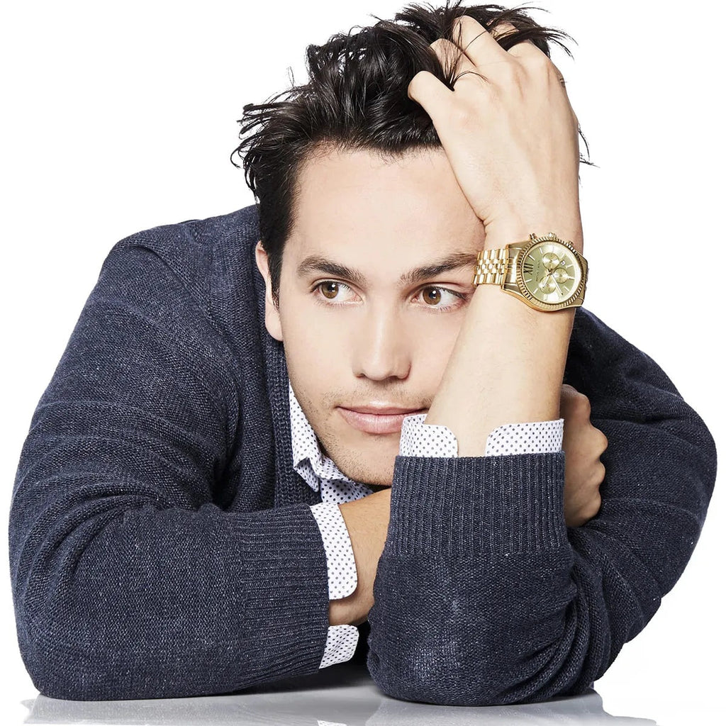 Michael Kors MK8281 gold watch on men’s wrist