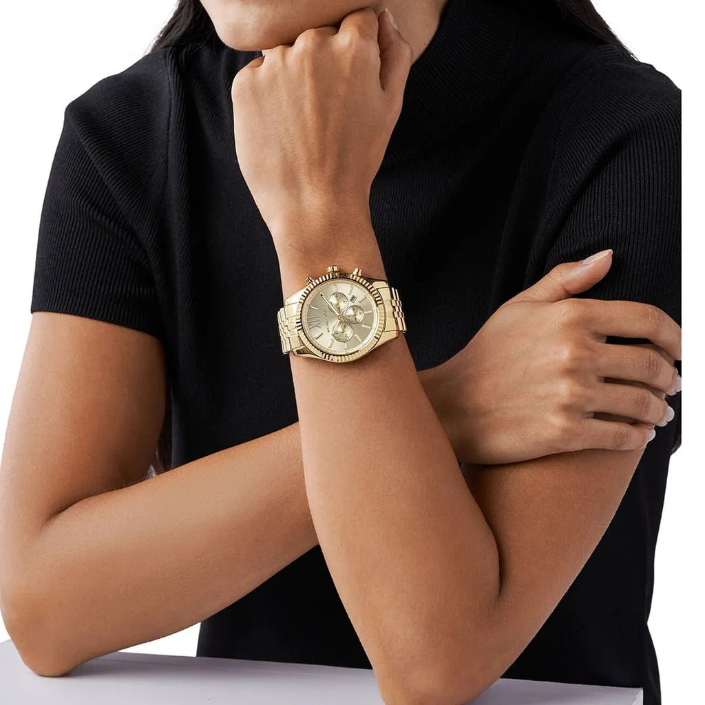 Michael Kors MK8281 Lexington watch on wrist with gold dial