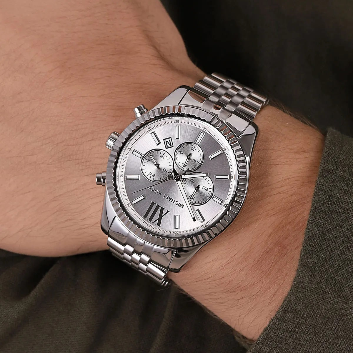 Michael Kors MK8405 Lexington watch on wrist with silver dial