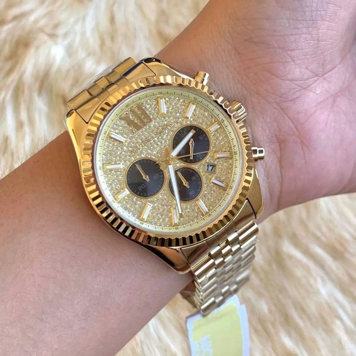 Michael Kors MK8494 Lexington gold watch on wrist