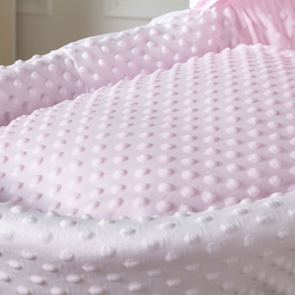 Pink dimple grey wicker Moses basket with stand close-up image
