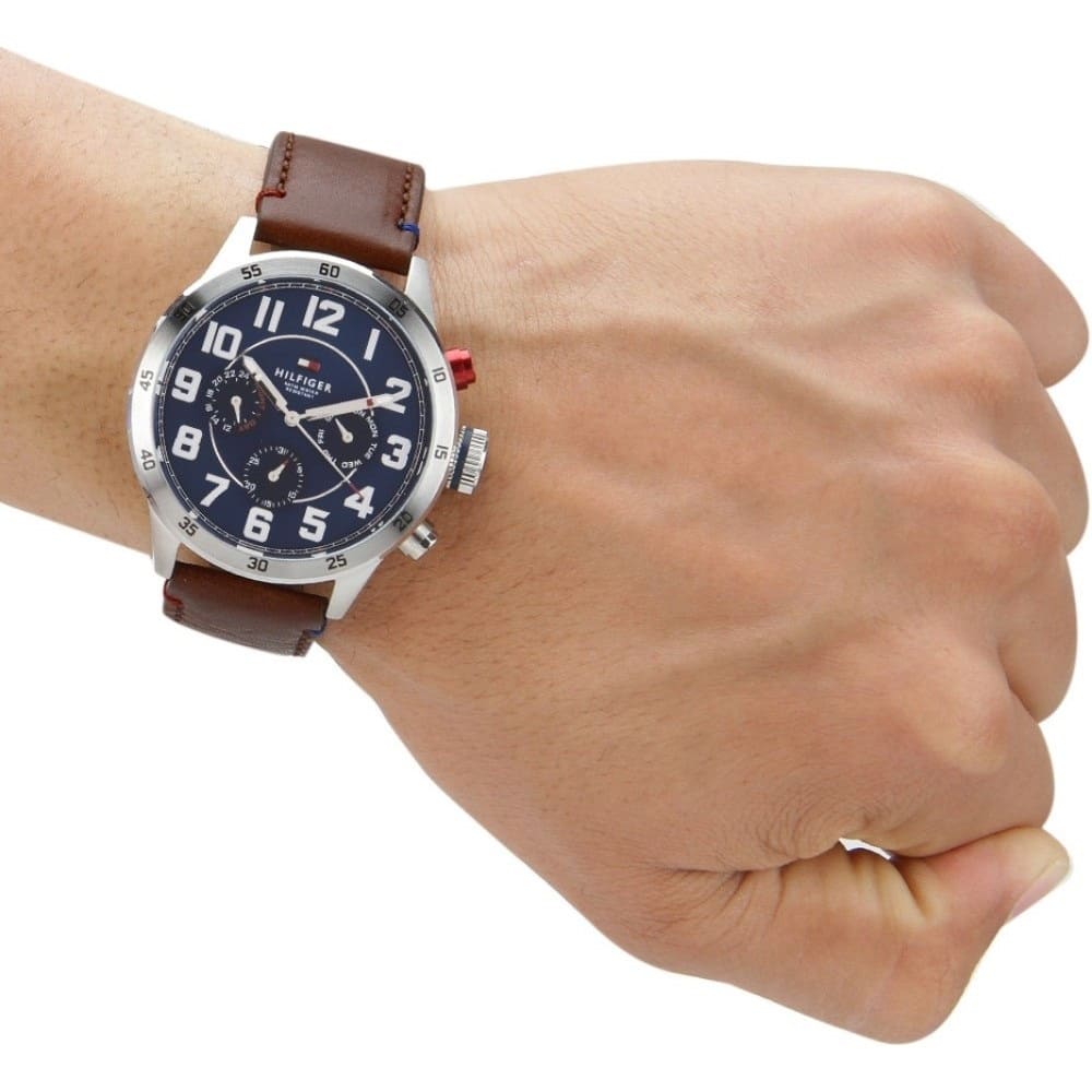 Tommy Hilfiger 1791066 brown leather strap watch on wrist with blue dial