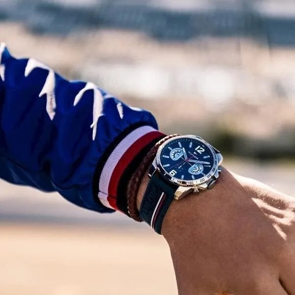 Tommy Hilfiger 1791474 Decker watch on wrist with blue strap and rose gold case