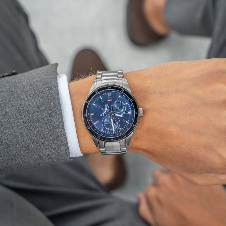 Tommy Hilfiger 1791640 Chase watch on wrist with silver strap and blue dial