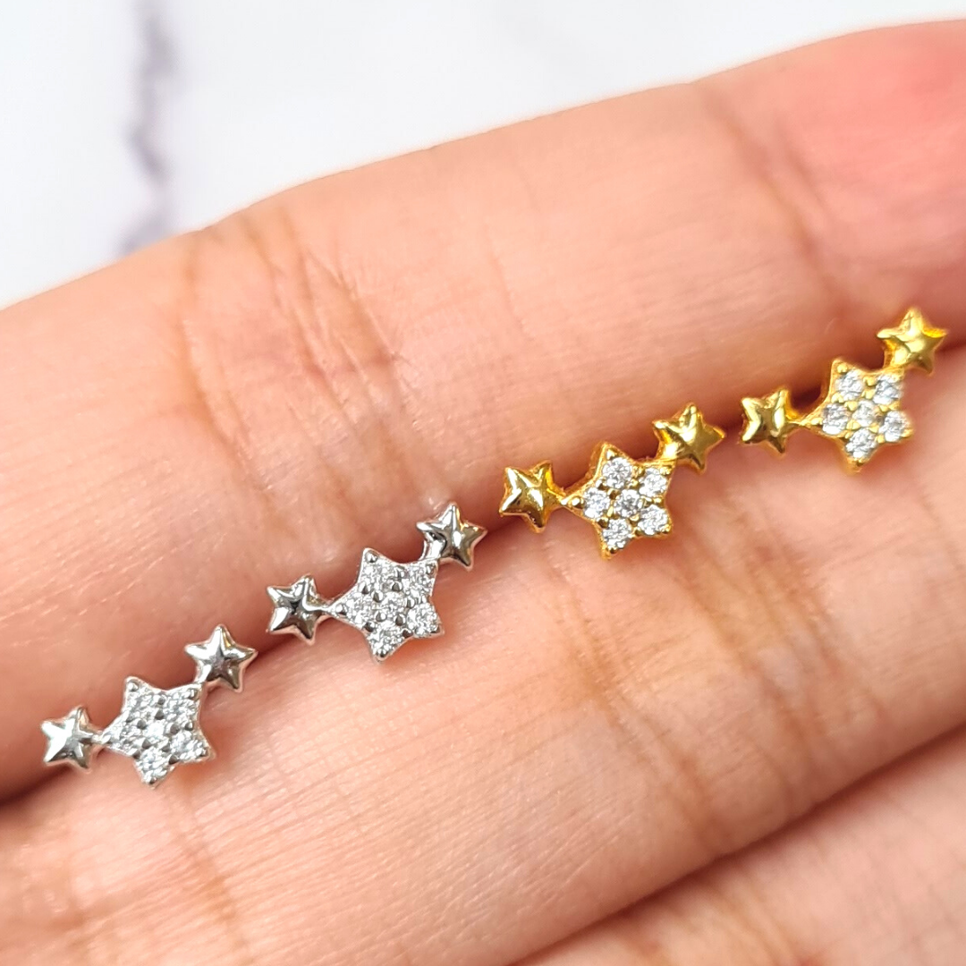 Trio of stars earrings in gold and silver group image